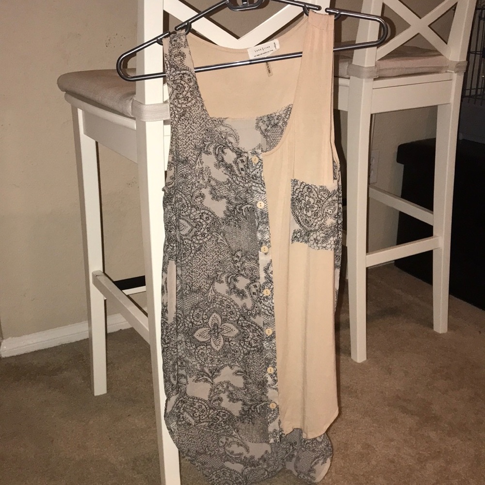 High/low tank top. Patterned part is sheer.